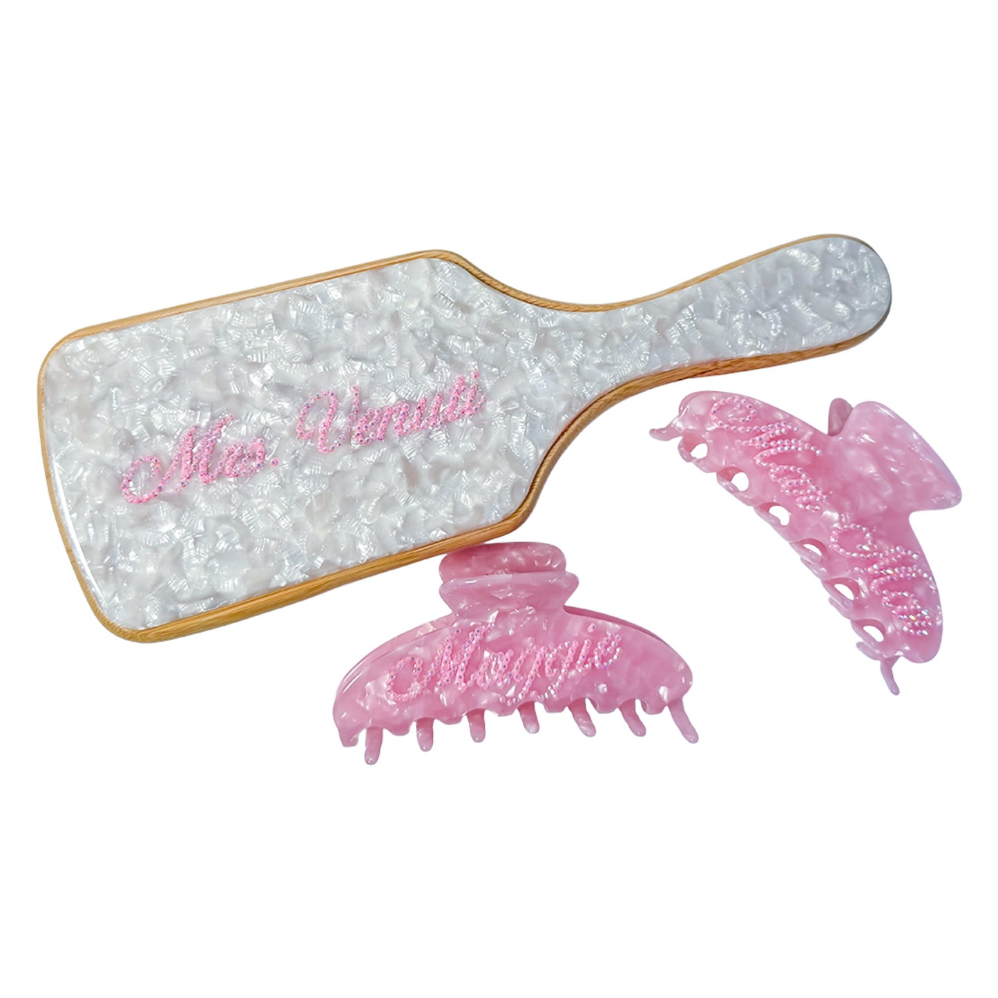 Custom hair gift set with white marbled paddle brush and pink claw clips — personalized with names in crystals by Local Love by Lauren.