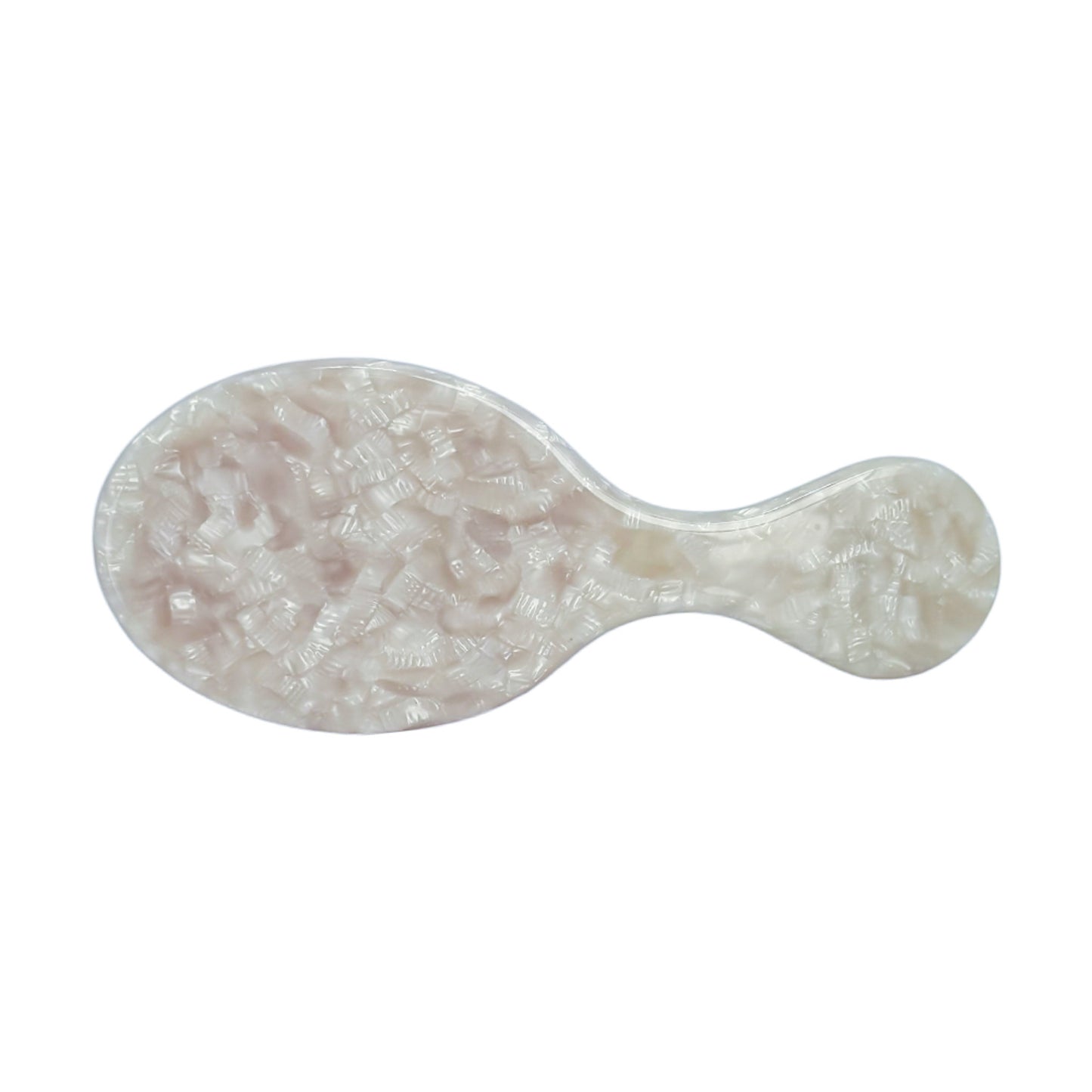 Top view of a mini travel hairbrush with a pearl-textured ivory handle, designed for compact styling and on-the-go touch-ups.