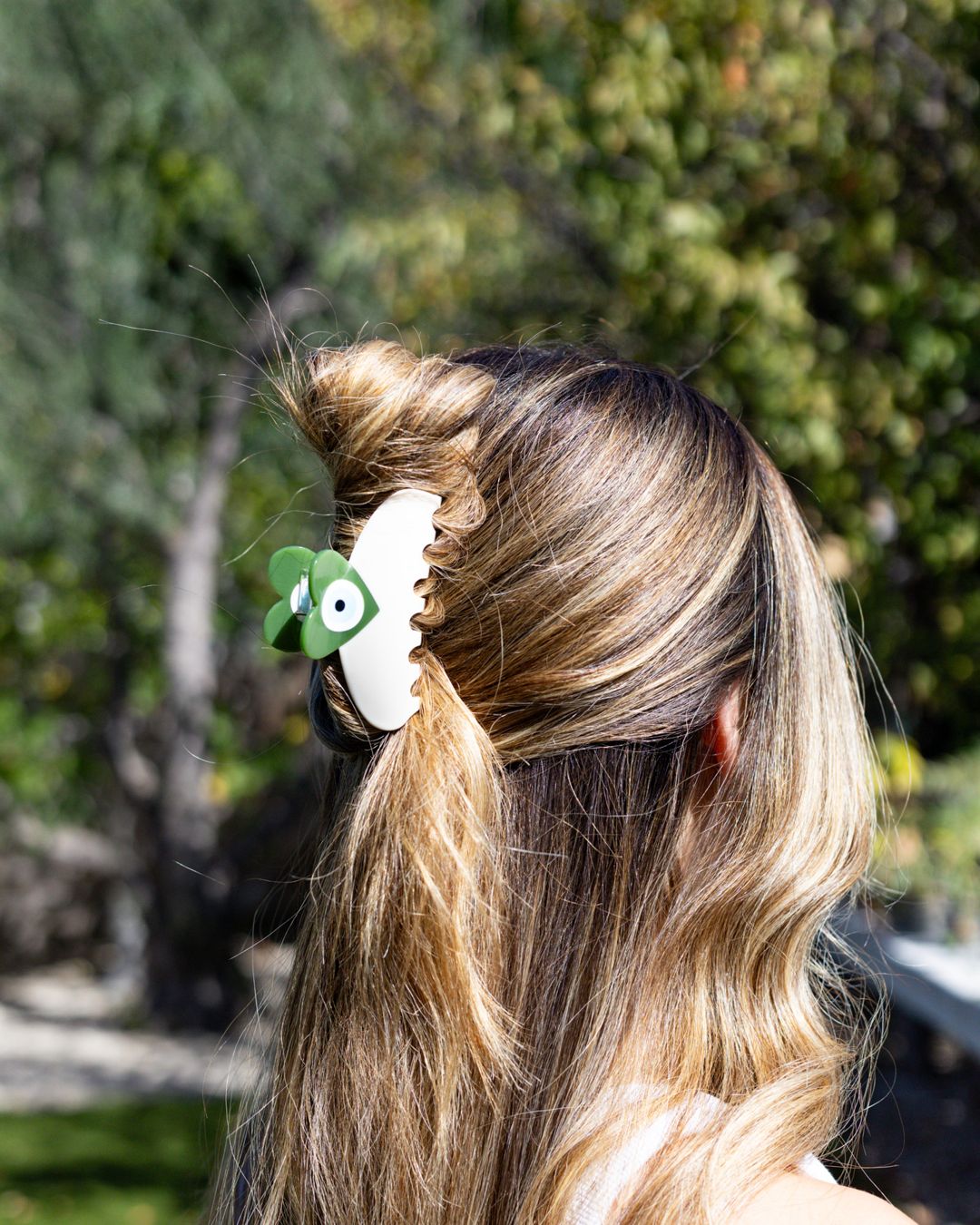 Evil eye claw clip worn in a half-up style – Local Love by Lauren