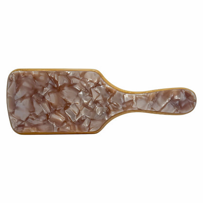 Meet the Bamboo Babe Brush—your new hair care essential. Crafted with a lightweight white bamboo base and topped with a marbled light brown finish, this paddle brush detangles, smooths, and tames frizz like a pro. Its wide paddle shape is ideal for all hair types, making it perfect for blow-drying or everyday styling. Plus, it’s customizable, so you can make it your own or gift it with a personal touch. Whether it's for bridesmaids, birthdays, or your daily glam routine, this brush delivers looks
