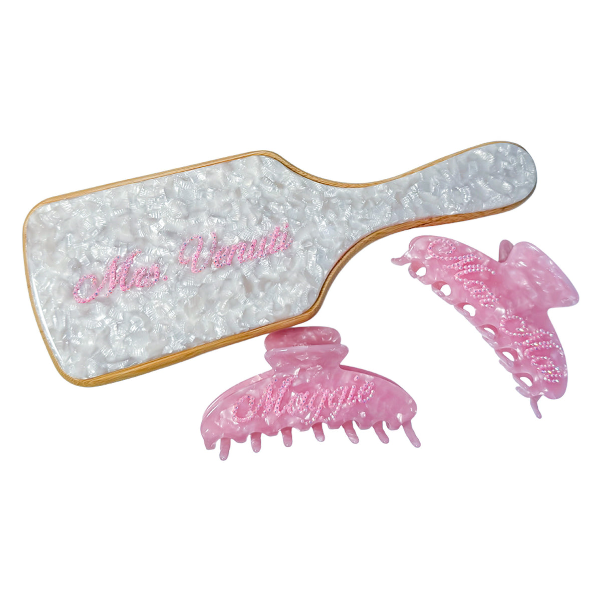 Custom hair gift set with white marbled paddle brush and pink claw clips — personalized with names in crystals by Local Love by Lauren.