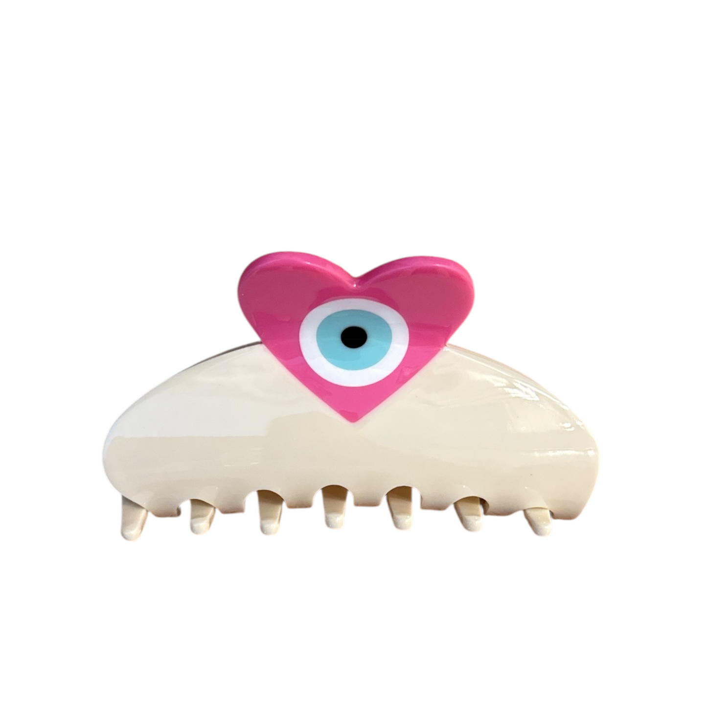 Hair clip with a pink heart and blue eye on a white background