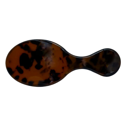 The Clutch Brush in Tortoise Shell is your go-to mini hairbrush for touch-ups on the go. Its chic compact design fits perfectly in your purse, gym bag, or travel pouch. Made for all hair types, this brush glides smoothly through tangles without pulling, making it ideal for detangling, smoothing, and adding shine. Finished in a glossy tortoise shell pattern, each brush is personalized to order—perfect for gifting or keeping it cute for yourself. A must-have for bridesmaids, bachelorettes, or daily glam.