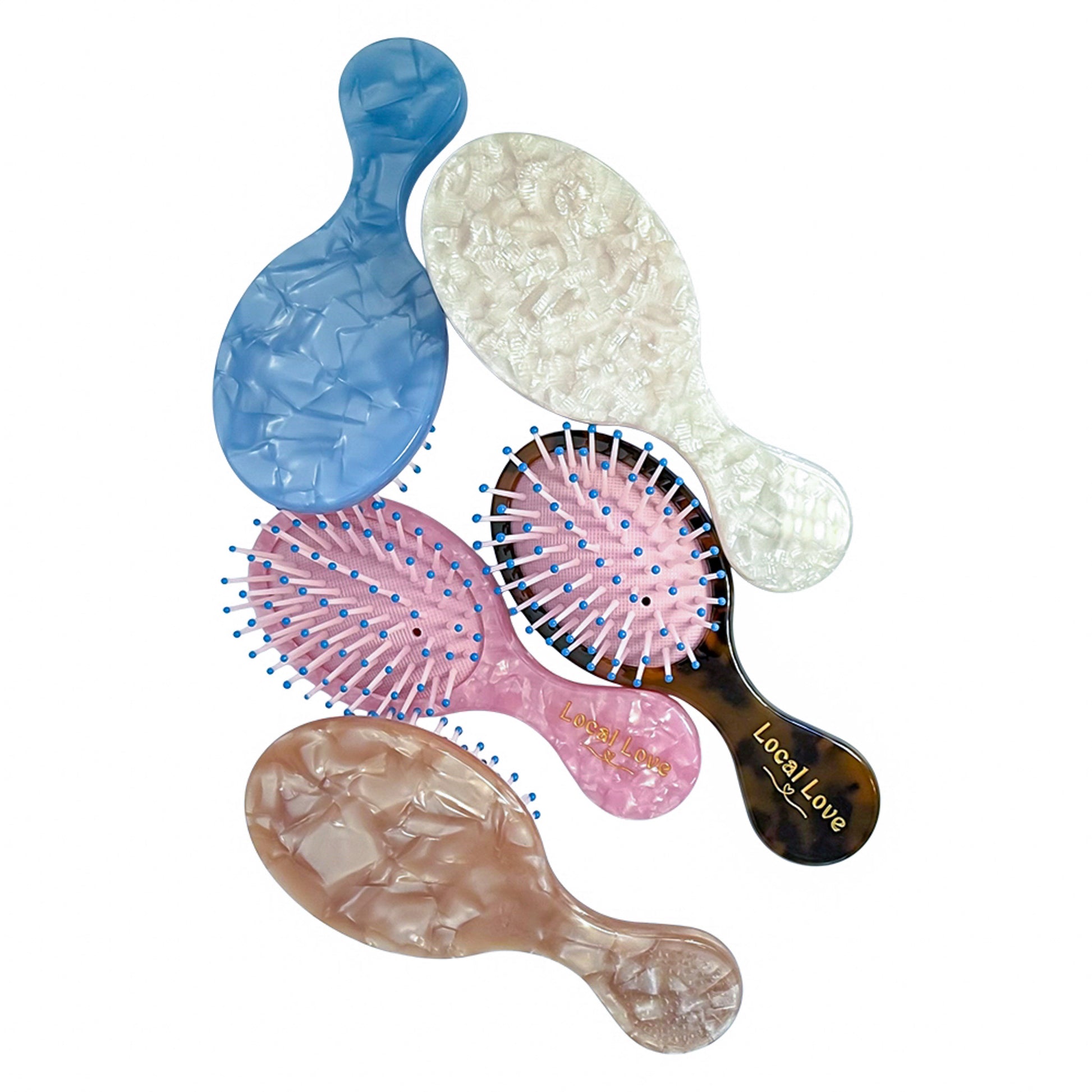 Set of 5 mini detangler brushes in pink, ivory, nude, blue, and tortoise — compact and customizable by Local Love by Lauren.