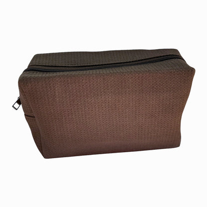 Dark brown waffle-textured zip pouch — sleek and functional travel bag by Local Love by Lauren.