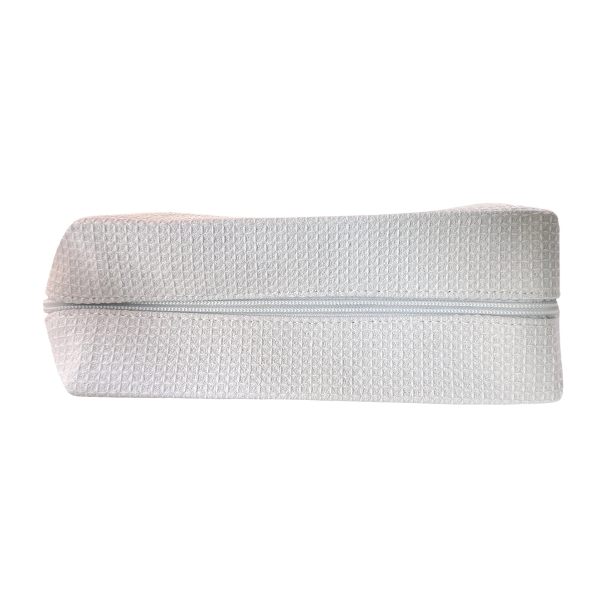Custom white waffle-textured travel pouch — personalized makeup or toiletry bag by Local Love by Lauren.