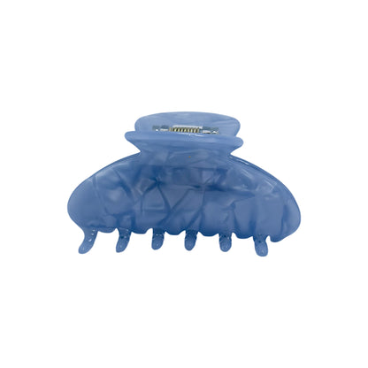 Front view of the OG Claw hair clip in standard size with a glossy sky blue marbled finish and wide grip for secure hold.

