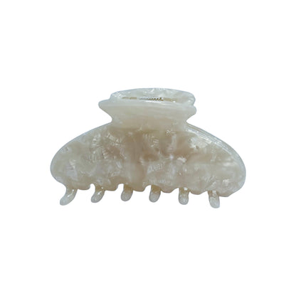 Personalized OG Claw in white marble finish, standard size with curved grip for everyday hair styling.
